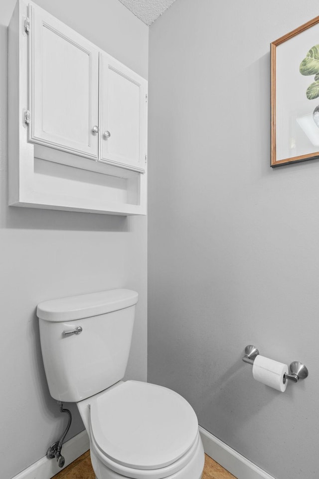 11427 Elmwood Ave N, Champlin, MN 55316 - half bathroom with toilet and baseboards
