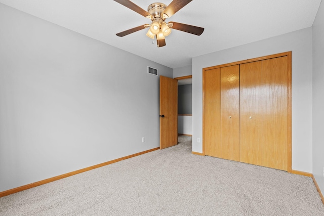 11427 Elmwood Ave N, Champlin, MN 55316 - unfurnished bedroom with carpet floors, a closet, and a ceiling fan