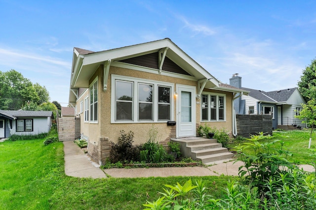 4129 7th St NE, Columbia Heights, MN 55421 - bungalow-style house featuring stucco siding