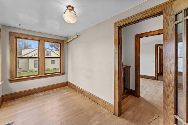 4129 7th St NE, Columbia Heights, MN 55421 - unfurnished room with baseboards and light wood-style flooring