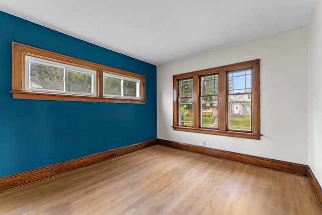 4129 7th St NE, Columbia Heights, MN 55421 - spare room featuring baseboards and light wood-style flooring