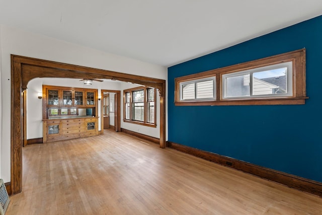4129 7th St NE, Columbia Heights, MN 55421 - unfurnished living room featuring light wood-style flooring and ceiling fan