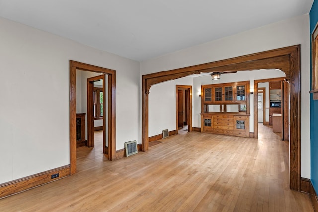 4129 7th St NE, Columbia Heights, MN 55421 - unfurnished living room featuring light wood-type flooring and a ceiling fan