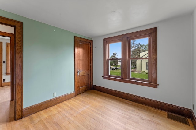 4129 7th St NE, Columbia Heights, MN 55421 - spare room with baseboards and light wood-style flooring