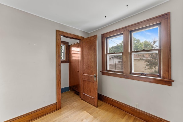 4129 7th St NE, Columbia Heights, MN 55421 - spare room featuring baseboards and light wood finished floors