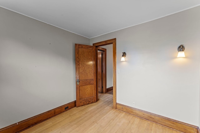 4129 7th St NE, Columbia Heights, MN 55421 - unfurnished room with light wood finished floors and crown molding