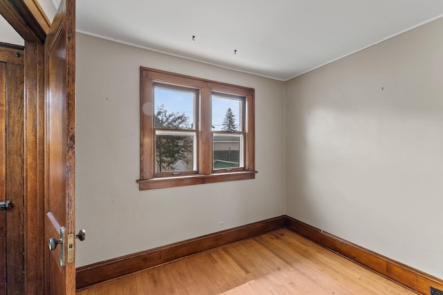 4129 7th St NE, Columbia Heights, MN 55421 - spare room with light wood-style flooring and crown molding