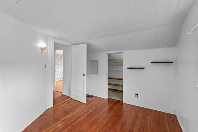 4129 7th St NE, Columbia Heights, MN 55421 - unfurnished bedroom with hardwood / wood-style floors and vaulted ceiling