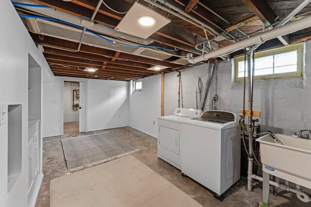 4129 7th St NE, Columbia Heights, MN 55421 - below grade area with washing machine and clothes dryer and a sink