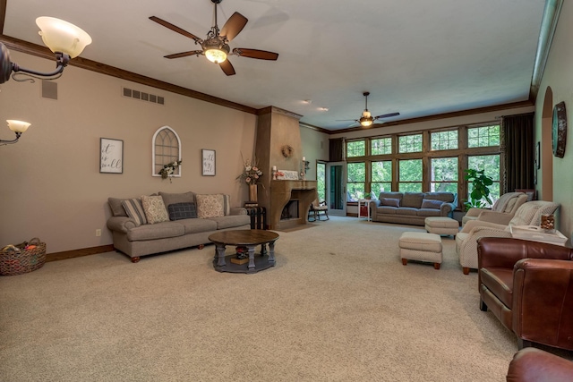 56273 185th Ln, Rapidan Twp, MN 56037 - living area with a ceiling fan, carpet floors, crown molding, a large fireplace, and baseboards
