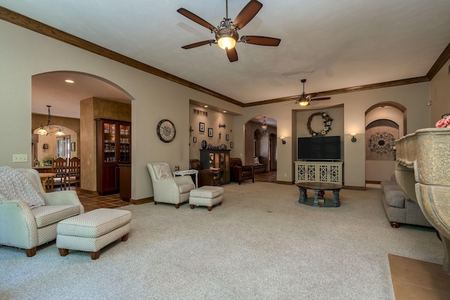 56273 185th Ln, Rapidan Twp, MN 56037 - carpeted living room with arched walkways, a ceiling fan, ornamental molding, baseboards, and recessed lighting
