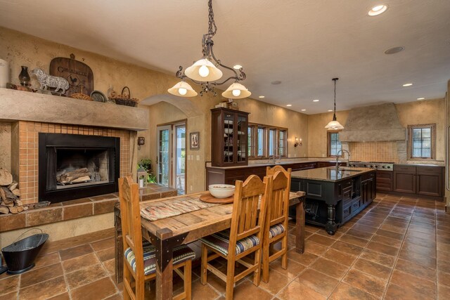 56273 185th Ln, Rapidan Twp, MN 56037 - dining area featuring recessed lighting, a tile fireplace, and stone tile flooring