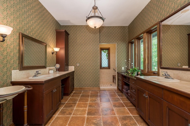 56273 185th Ln, Rapidan Twp, MN 56037 - bathroom featuring walk in shower, two vanities, and wallpapered walls