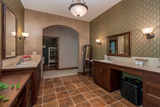 56273 185th Ln, Rapidan Twp, MN 56037 - bathroom with wallpapered walls and two vanities
