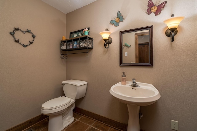 56273 185th Ln, Rapidan Twp, MN 56037 - bathroom featuring toilet and baseboards
