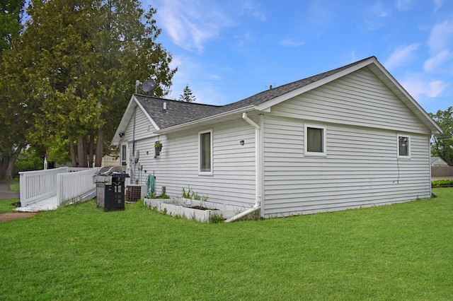 630 Oak St, Crosby, MN 56441 - view of home's exterior with roof with shingles, a yard, and central AC unit