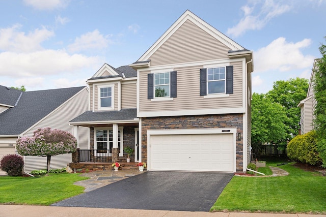 2392 Molnau Ct, Chaska, MN 55318 - view of front of house with asphalt driveway, covered porch, stone siding, and a garage