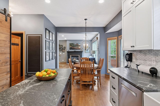 2392 Molnau Ct, Chaska, MN 55318 - kitchen with dishwasher, backsplash, white cabinetry, recessed lighting, and decorative light fixtures