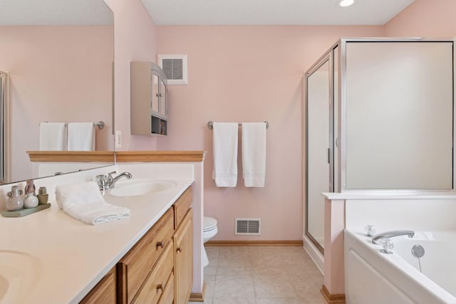 2392 Molnau Ct, Chaska, MN 55318 - bathroom with a shower stall, double vanity, toilet, baseboards, and a bath