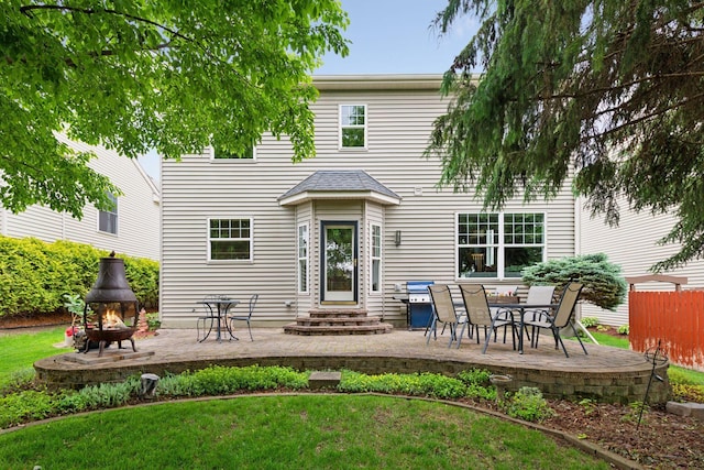 2392 Molnau Ct, Chaska, MN 55318 - back of property with a patio and an outdoor fire pit