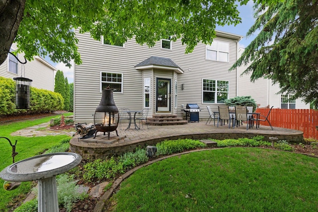 2392 Molnau Ct, Chaska, MN 55318 - rear view of house featuring a fire pit, a patio area, entry steps, and central AC unit