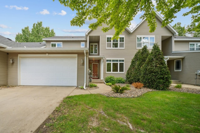 1106 Shumway Ct, Faribault, MN 55021 - traditional-style home featuring a front lawn, a garage, and concrete driveway