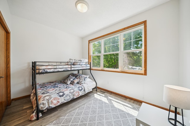 1106 Shumway Ct, Faribault, MN 55021 - bedroom with baseboards and wood finished floors