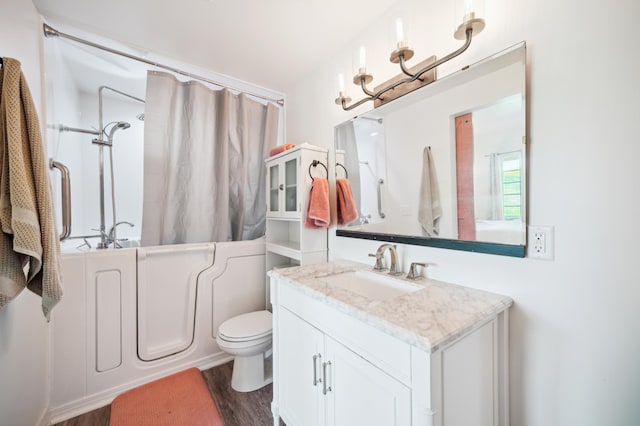 1106 Shumway Ct, Faribault, MN 55021 - full bathroom featuring vanity, shower / bath combination with curtain, wood finished floors, and toilet