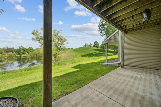 1106 Shumway Ct, Faribault, MN 55021 - view of green lawn featuring a water view and a patio