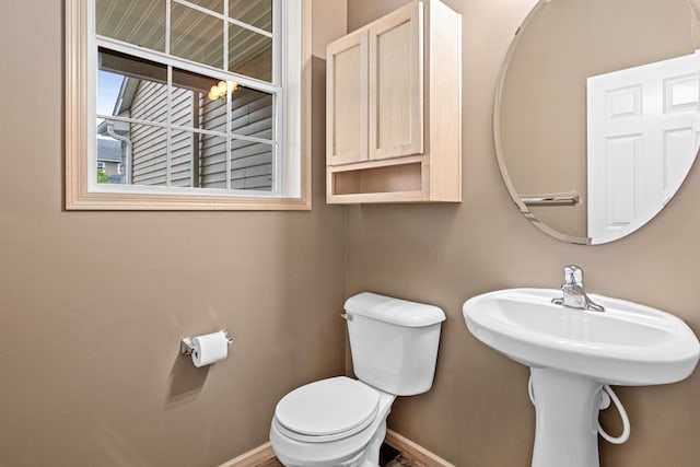 15440 Eminence Ave N Unit 2, Hugo, MN 55038 - half bathroom featuring baseboards, toilet, and a sink