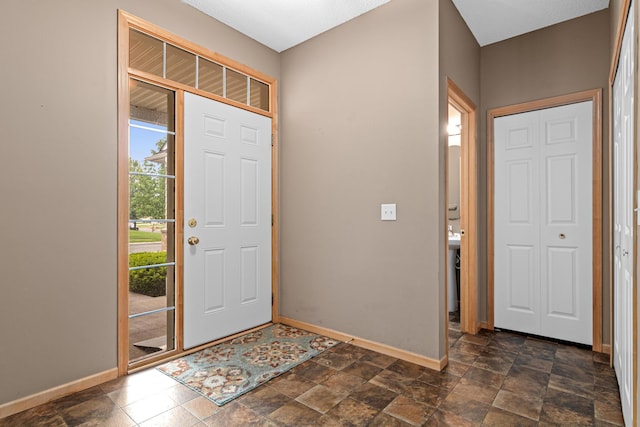 15440 Eminence Ave N Unit 2, Hugo, MN 55038 - entrance foyer with baseboards and dark stone finish floors
