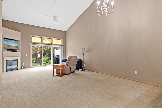 15440 Eminence Ave N Unit 2, Hugo, MN 55038 - living room with high vaulted ceiling, carpet floors, ceiling fan, a glass covered fireplace, and baseboards
