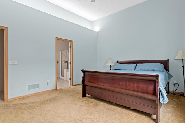 15440 Eminence Ave N Unit 2, Hugo, MN 55038 - carpeted bedroom with baseboards, connected bathroom, and ceiling fan