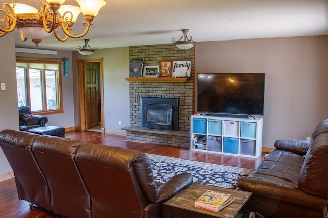 44818 215th Ave, Staples Twp, MN 56479 - living room featuring wood finished floors, a chandelier, and a brick fireplace