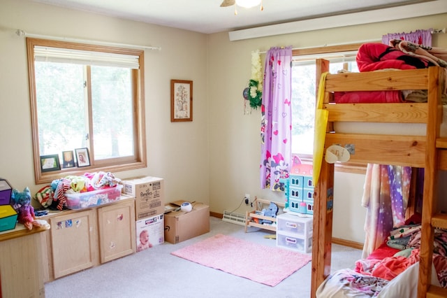 44818 215th Ave, Staples Twp, MN 56479 - carpeted bedroom featuring multiple windows and ceiling fan
