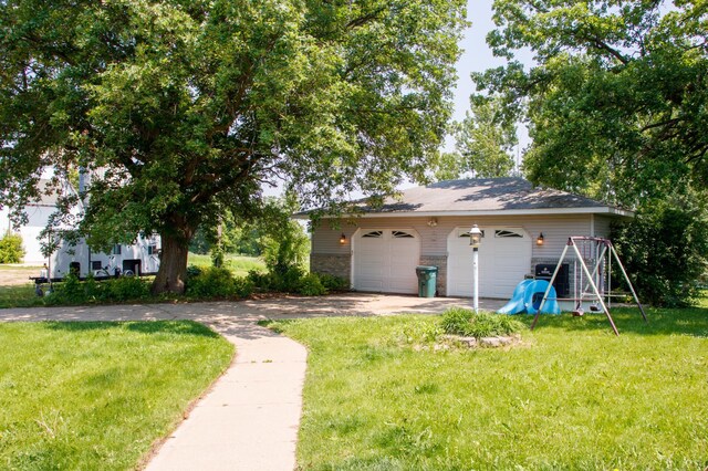 44818 215th Ave, Staples Twp, MN 56479 - view of green lawn featuring a detached garage and an outbuilding