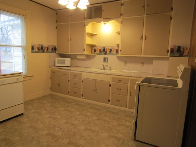 421 8th Ave, Madison, MN 56256 - kitchen with white appliances, a sink, light countertops, open shelves, and healthy amount of natural light
