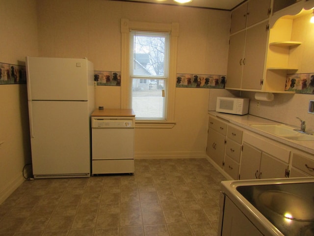 421 8th Ave, Madison, MN 56256 - kitchen featuring white appliances, a sink, open shelves, light countertops, and white cabinetry