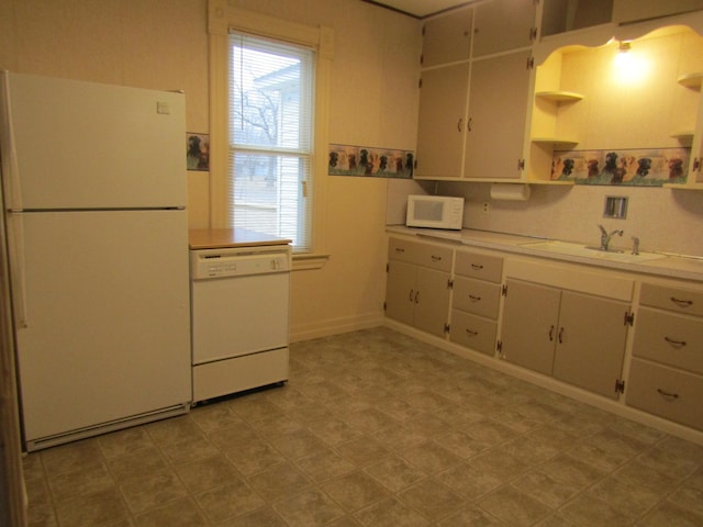 421 8th Ave, Madison, MN 56256 - kitchen featuring white appliances, open shelves, a sink, and healthy amount of natural light
