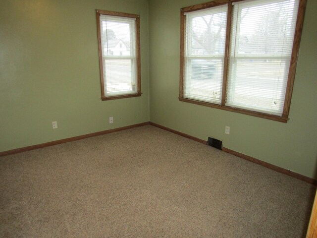 421 8th Ave, Madison, MN 56256 - unfurnished room featuring carpet flooring and baseboards