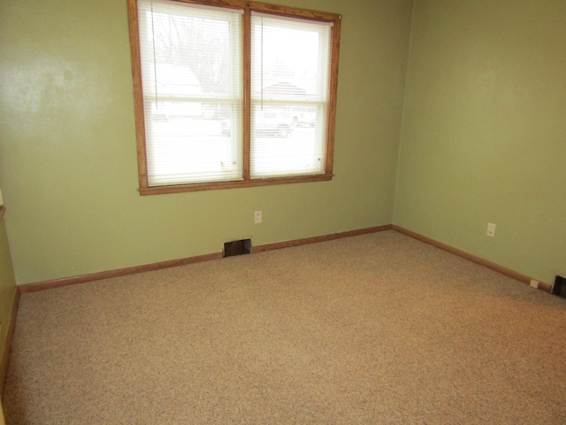 421 8th Ave, Madison, MN 56256 - carpeted spare room featuring healthy amount of natural light and baseboards