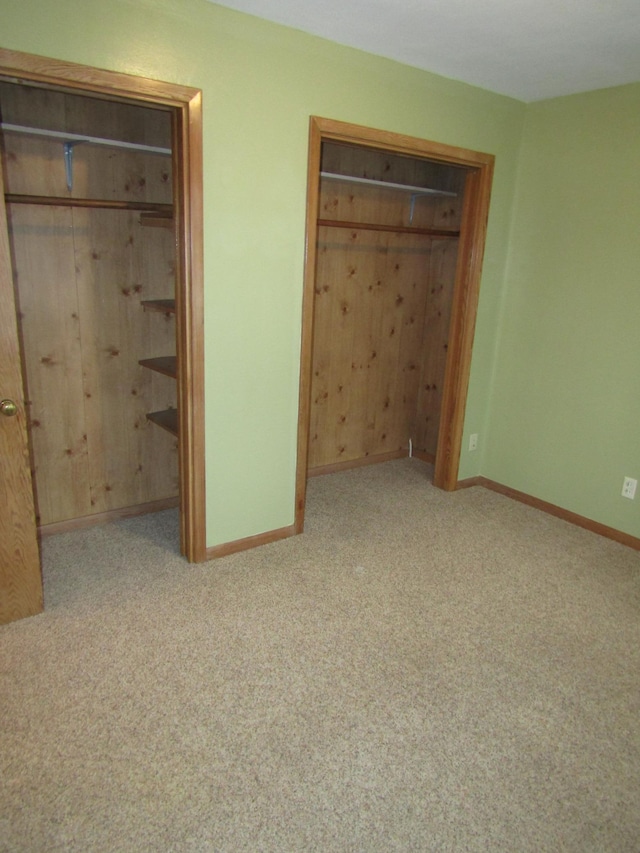 421 8th Ave, Madison, MN 56256 - unfurnished bedroom with baseboards and carpet