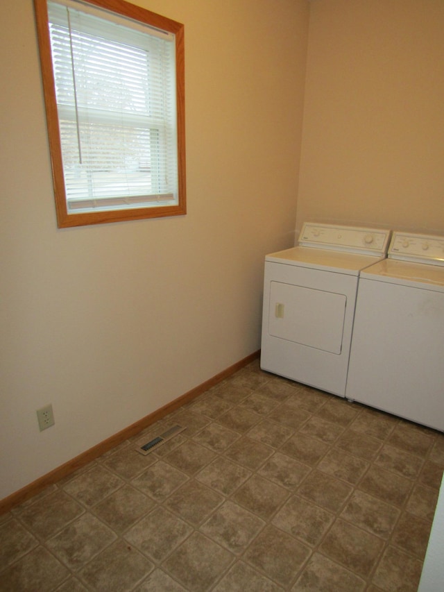 421 8th Ave, Madison, MN 56256 - laundry room with washing machine and clothes dryer and baseboards