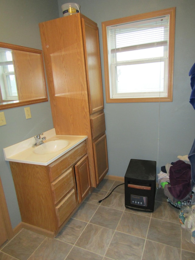 421 8th Ave, Madison, MN 56256 - bathroom featuring vanity and tile patterned floors