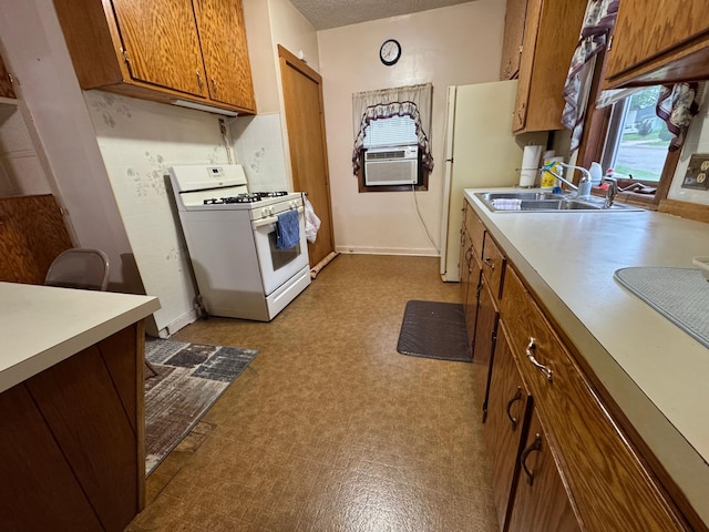 1020 Autumn St, Albert Lea, MN 56007 - kitchen with white appliances, a sink, brown cabinets, dark floors, and light countertops
