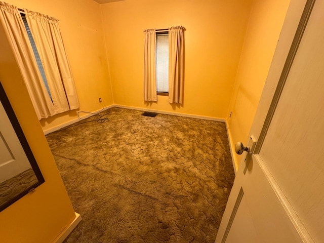 1020 Autumn St, Albert Lea, MN 56007 - spare room featuring carpet flooring and baseboards