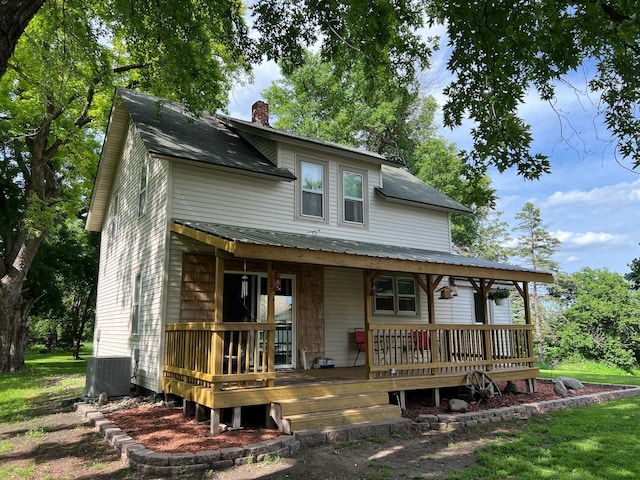 355 20th St SW, Benson, MN 56215 - view of front facade featuring a chimney and a porch