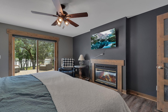 27806 Sundance Ln, Cold Spring, MN 56320 - bedroom with access to outside, wood finished floors, a ceiling fan, and a glass covered fireplace