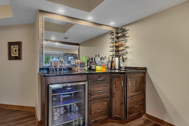 27806 Sundance Ln, Cold Spring, MN 56320 - indoor bar featuring beverage cooler, dark wood-type flooring, and recessed lighting
