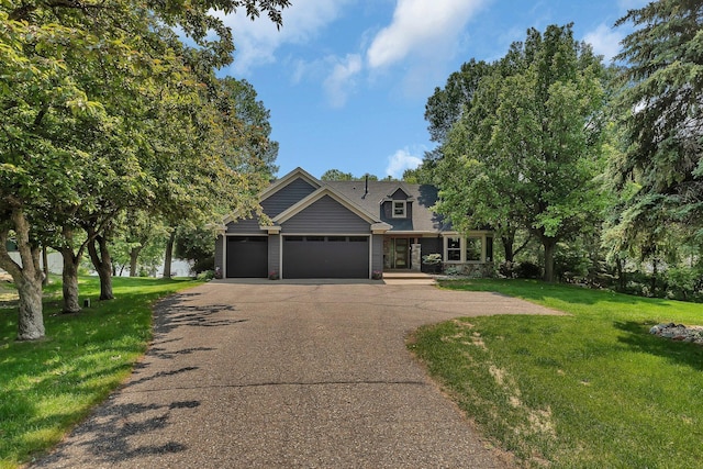27806 Sundance Ln, Cold Spring, MN 56320 - view of front of home featuring an attached garage, driveway, and a front yard